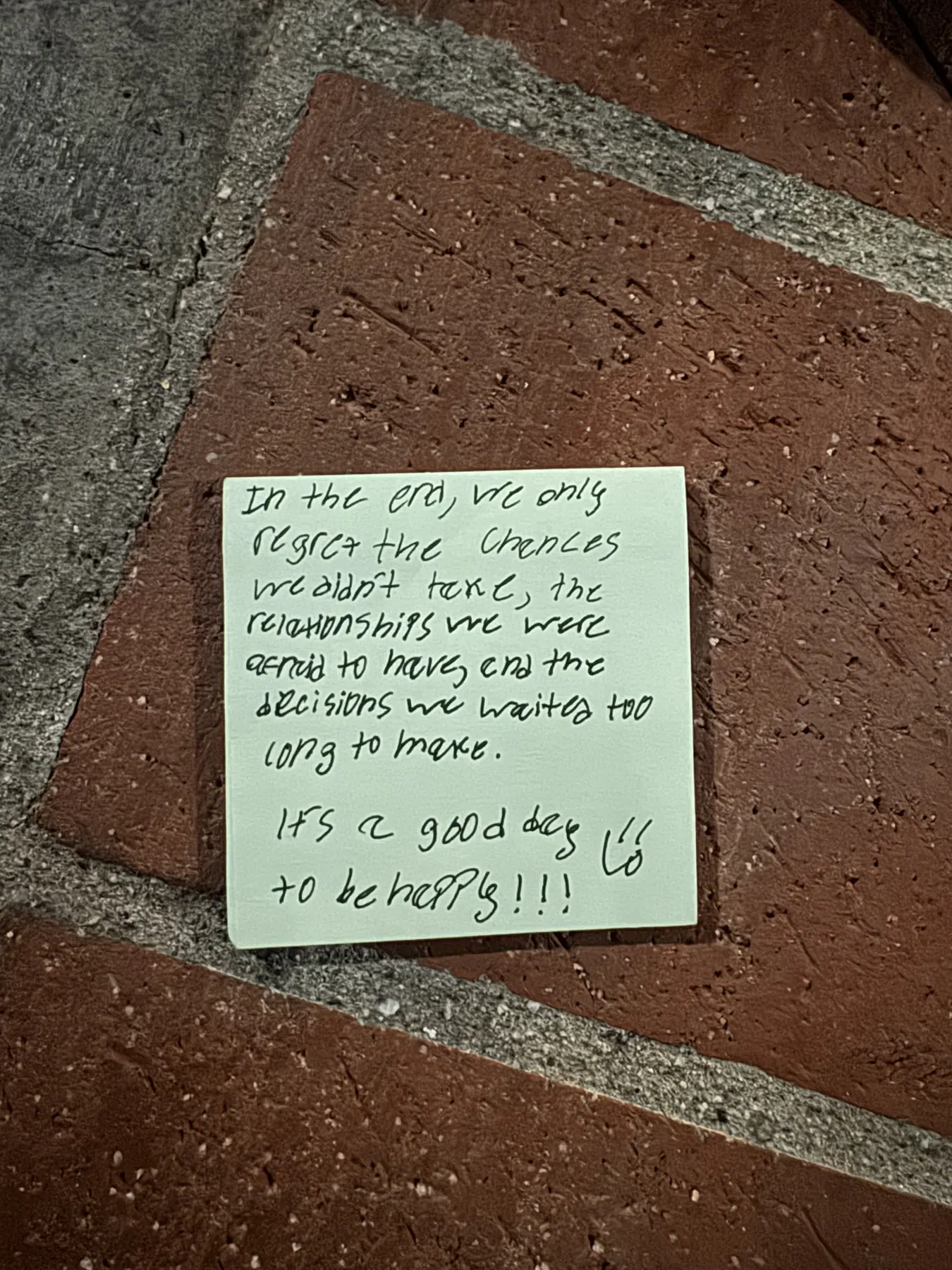 Handwritten sticky note with words of encouragement